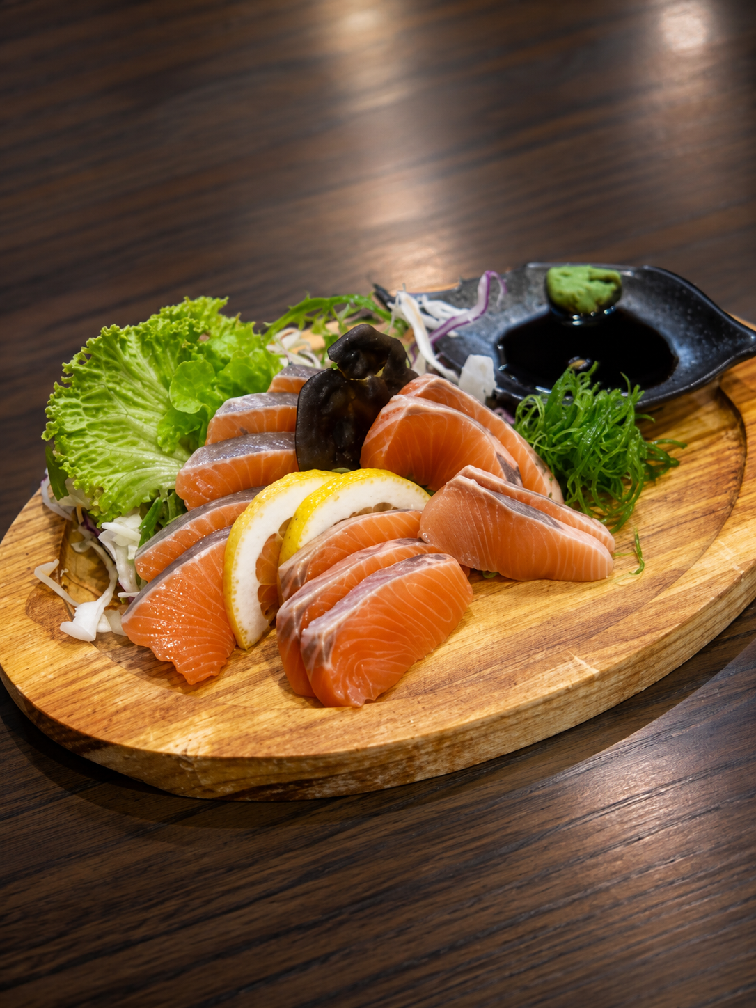 Salmon sashimi served on a wooden board